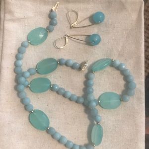 Aqua blue stone with gold necklace and earrings